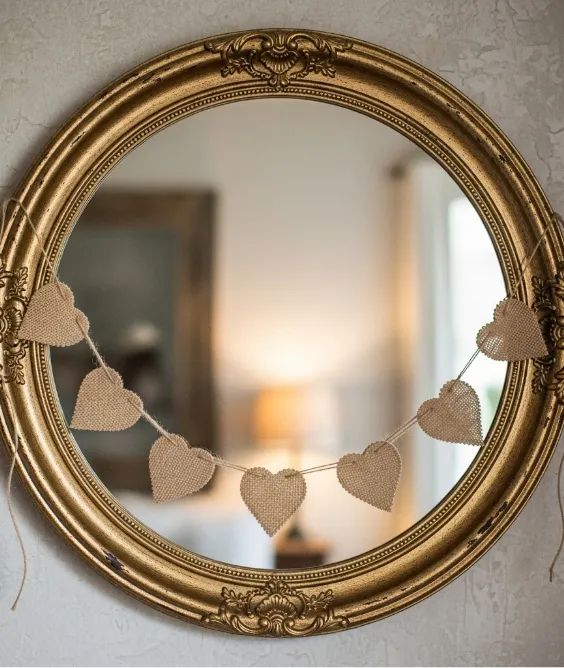 31 Aesthetic Valentine's Day Entryway Decor Ideas for a Romantic Home 15 Burlap Heart Banner Draped Across the MirrorBurlap Heart Banner Draped Across the Mirror